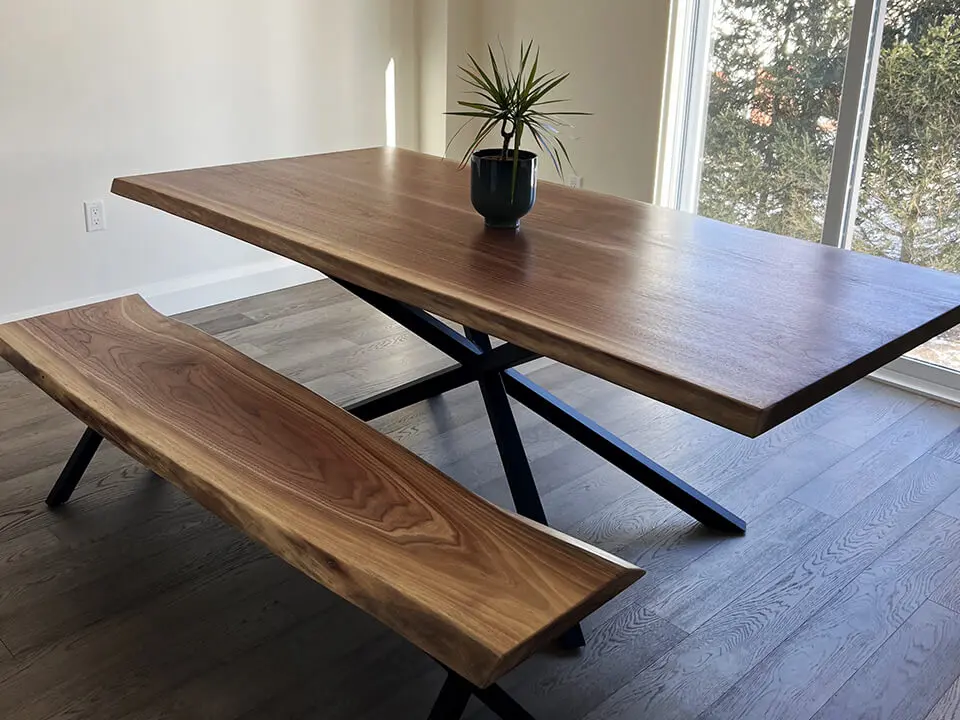 Modern wooden table with a plant placed on it