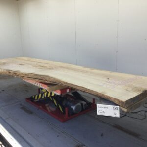 large thin slab of wood onto mechanical red stand