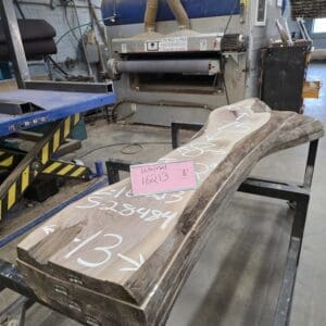 Live-edge wood slab in woodworking shop