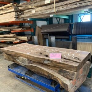 Large live-edge wood slab on pallet